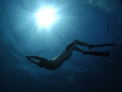 Freediver and sunburst with D100 on very high F stop and ... by Fiona Ayerst 